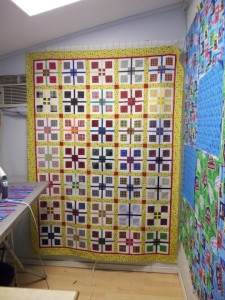 Remi's quilt Top: 9-Patch plaid.